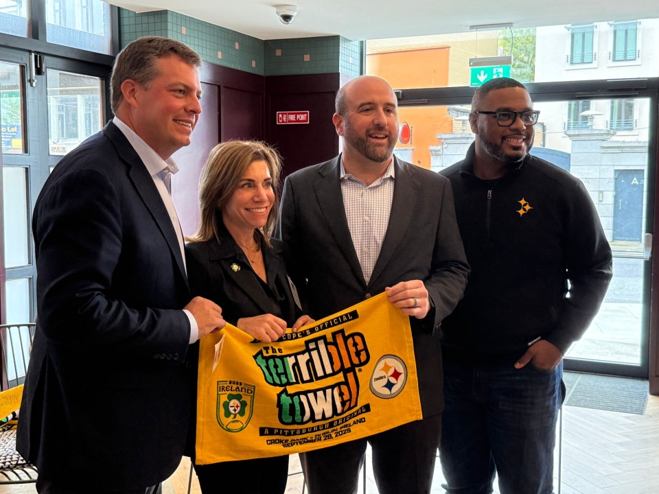 Community leaders holding a yellow Terrible Towel